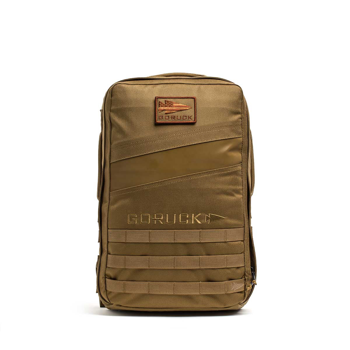 The tan Rucker 4.0 features a front patch, zipper pocket, and horizontal webbing on the lower section—perfect as a weighted rucksack or for fitness training.