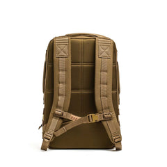 Rucker 4.0 rucking backpack in tan, displayed from the back on a white background, features padded shoulder straps and a chest buckle.