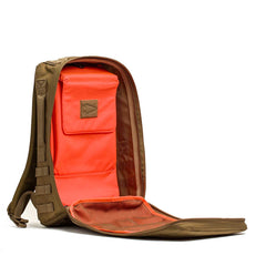 The Rucker 4.0 backpack in brown features a front-opening design that reveals bright orange interior pockets and mesh compartments—ideal for fitness training on the go.