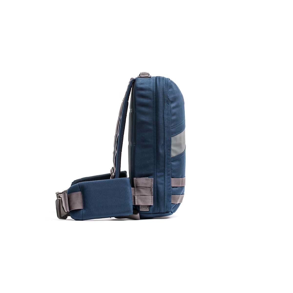 Side view of the Rucker 4.0, a blue and gray shoulder bag with an adjustable strap, ideal for rucking, shown against a white background.