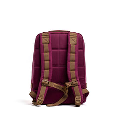 A maroon Rucker 4.0 rucksack with tan padded shoulder straps and a top handle, shown from the back against a white background.