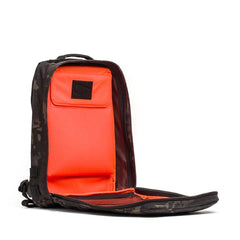 A black Rucker 4.0 rucksack unzipped to reveal a bright orange interior and mesh pocket—ideal for your next rucking adventure.