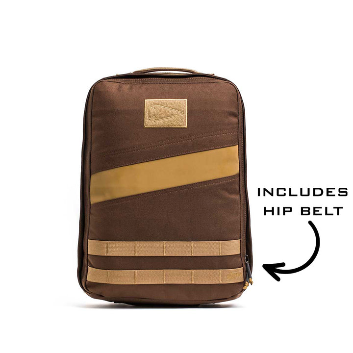 The Rucker 4.0 backpack features tan accents and a zipper with an arrow labeled "INCLUDES HIP BELT"—ideal for rucking or carrying your Ruck Plates.