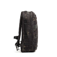 Side view of a black camouflage Rucker 4.0 backpack featuring multiple straps and a handle, designed for rucking and carrying Ruck Plates, shown against a white background.