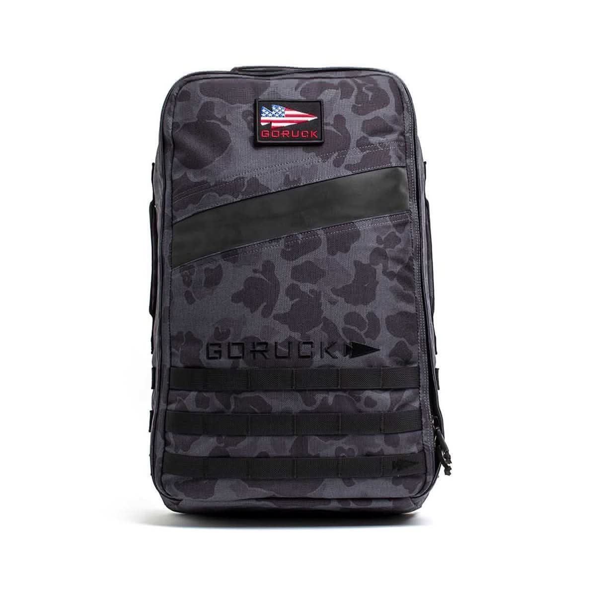 The Rucker 4.0 is a gray camouflage backpack with black accents, an American flag patch, and 