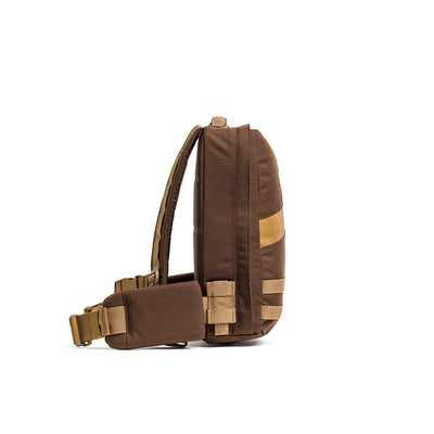 Rucker 4.0 sling backpack shown from the side with a thick strap and multiple compartments for easy rucking, displayed against a white background.