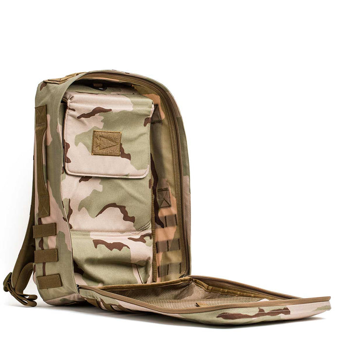 Tan camouflage Rucker 4.0 rucksack with a front pocket, shown open to display zipper and interior compartments—perfect for rucking adventures.
