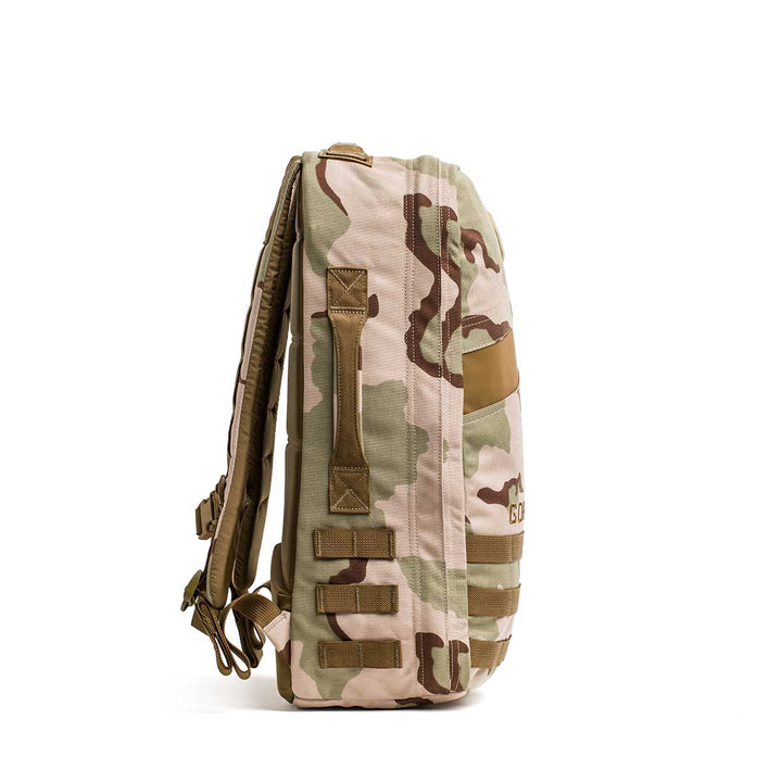 Side view of the Rucker 4.0 in tan and brown camouflage, featuring padded shoulder straps and MOLLE webbing—ideal for rucking adventures.