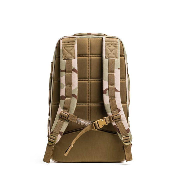 Tan and camouflage Rucker 4.0 shown from the back with padded straps and chest buckle—ideal for rucking adventures.
