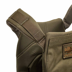 Close-up of an olive green Rucking Weight Vest strap and stitching, highlighting detailed material and texture—ideal for carrying Curved Ruck Plates during your next rucking session.