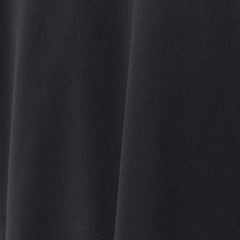 A close-up of black EnduraKnit fabric with visible texture and gentle folds showcases the durable quality of the Men's Long Sleeve Rucking Polo, ideal for rucking activities.