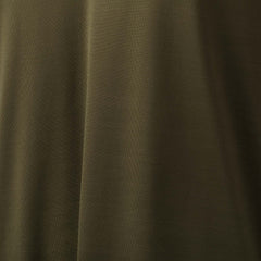 Close-up of olive green EnduraKnit fabric with soft folds and smooth texture, ideal for the Men's Long Sleeve Rucking Polo made in the USA.