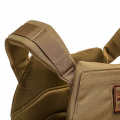 Close-up of a padded, tan fabric shoulder strap on the Rucking Weight Vest with visible stitching and quilted details—designed for comfort and support during weighted training.