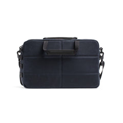 Navy blue rectangular Shoulder Bag - Waxed Canvas with black handles and a detachable strap, designed for asymmetrical carries, shown from the front.