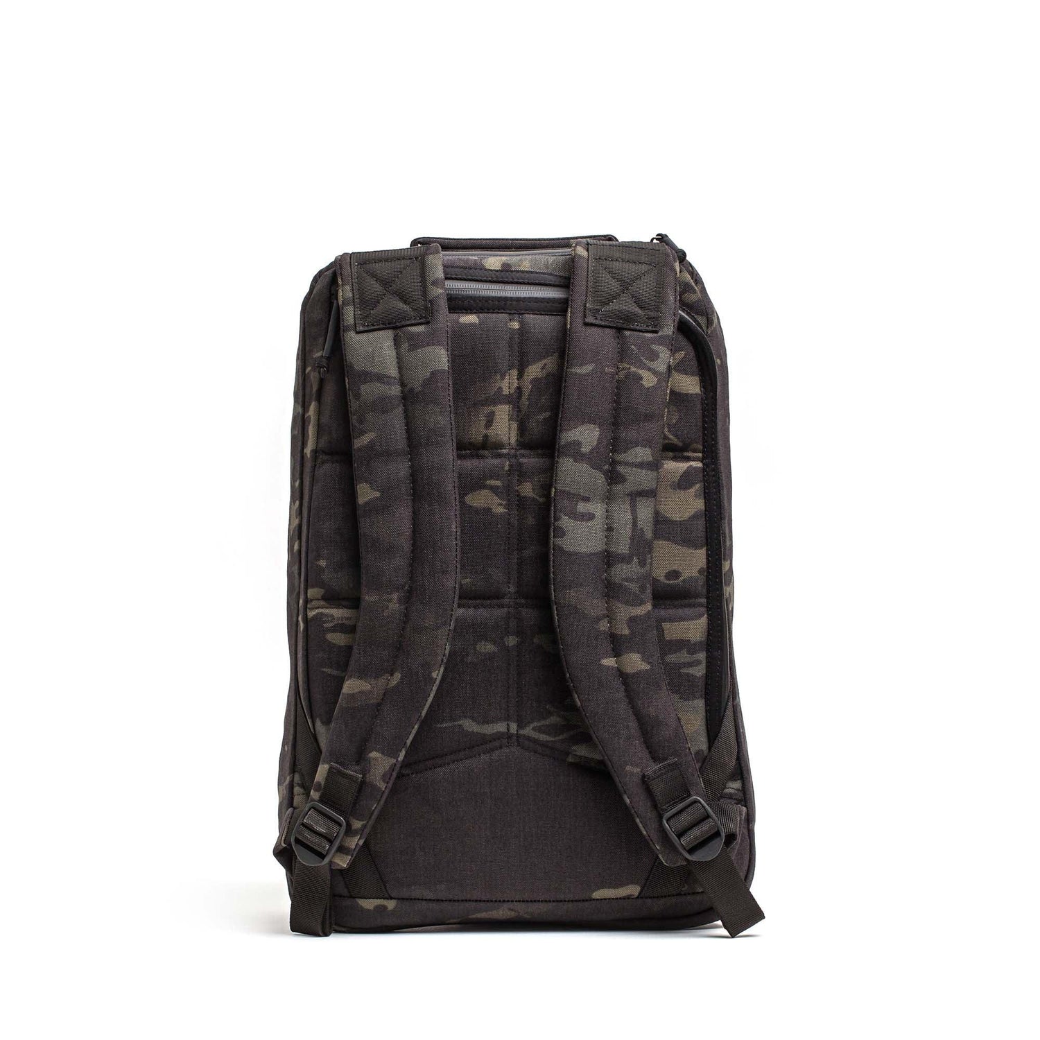 The GR1 USA Slick - Ballistic Nylon Cordura backpack in black and gray camo is shown from the back, highlighting its padded shoulder straps, back panel, and bombproof laptop compartment.