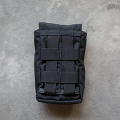 Black tactical side pocket with MOLLE webbing for GORUCK rucking gear on gray background