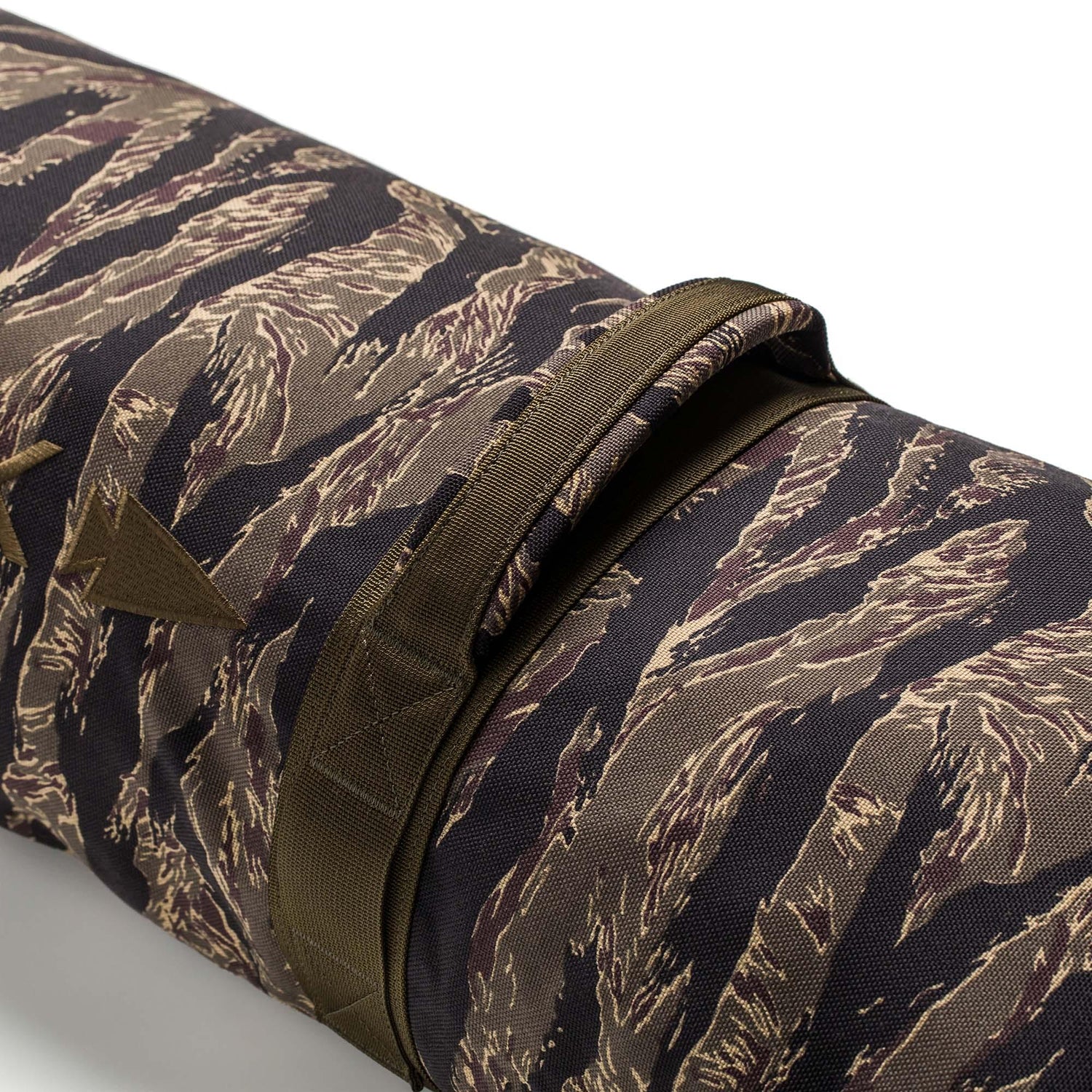 Close-up of a Simple Training Sandbag, featuring brown and black tiger stripe camouflage and a carrying handle—ideal for home gyms or sandbag training routines.