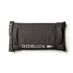 The Simple Training Sandbags in black, ideal for home gyms, come with sturdy handles and a "40" label on a white background. They are designed to withstand the toughest workouts and are backed by Goruck's Scars Lifetime Guarantee.