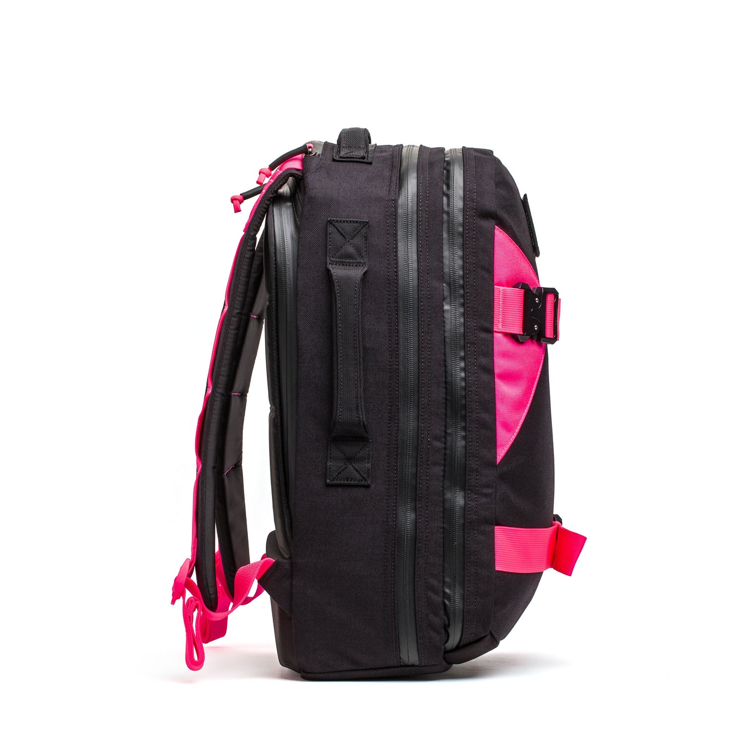 The Skate Ruck backpack, shown from the side against a white background, features black fabric with pink straps and accents plus a bombproof laptop compartment.