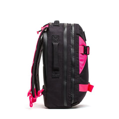 GORUCK black rucksack with hot pink straps and accents, side view on white background