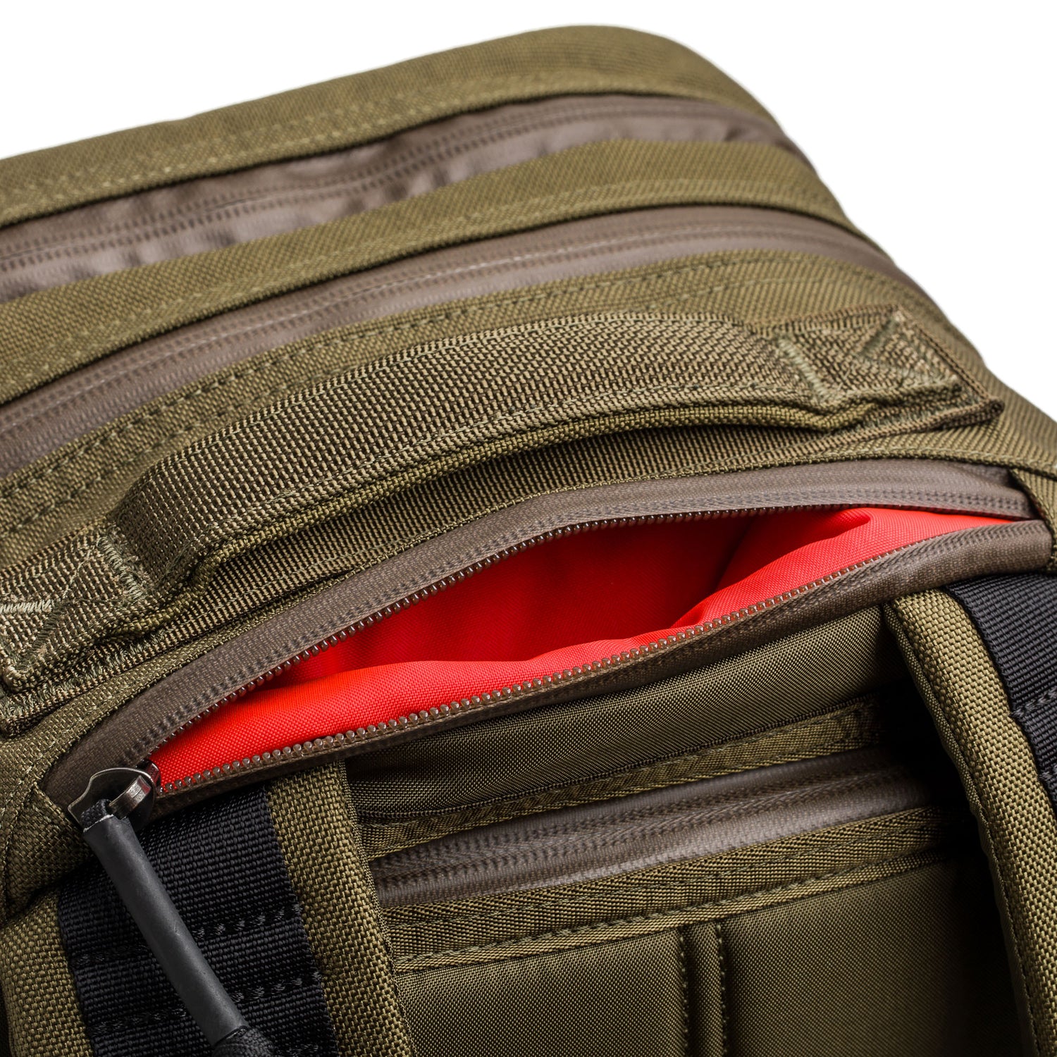 Close-up of a Skate Ruck in olive green with its zipper open, highlighting the bright red interior lining and durable laptop compartment.