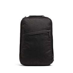 Black tactical GORUCK backpack with zippered front pocket and top handle, designed for rucking