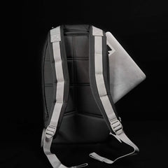 GORUCK durable black backpack with padded straps and laptop partially inserted, set against a black background