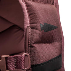 Close-up of a maroon strap with a black arrow symbol and plastic buckle, designed for the Spy Ruck | Women's Weighted Vest.