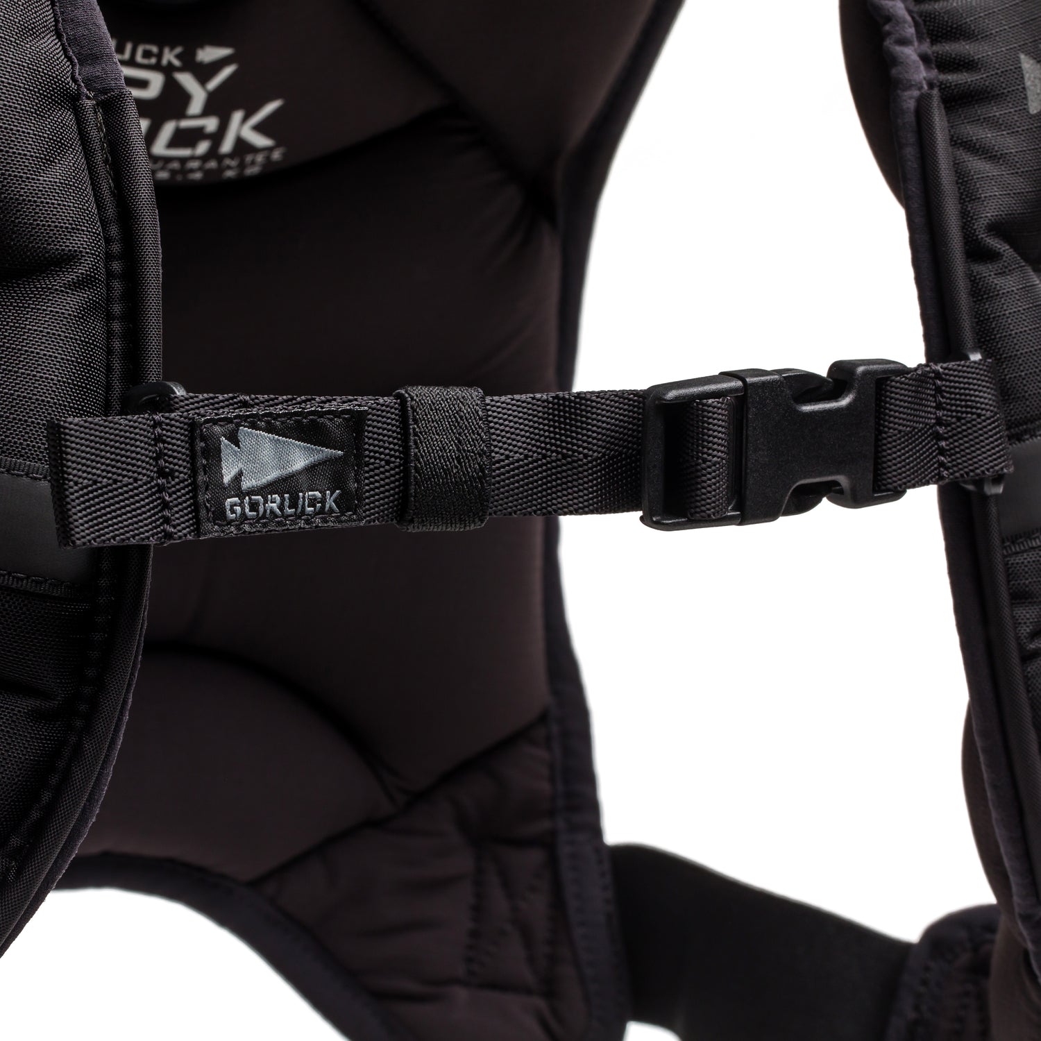 Close-up of a Spy Ruck chest strap with a plastic buckle and 