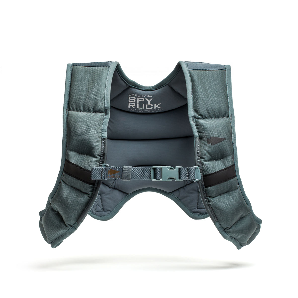 The Spy Ruck, a gray padded weighted vest designed for women’s fitness, features adjustable straps and a front buckle, shown on a white background.
