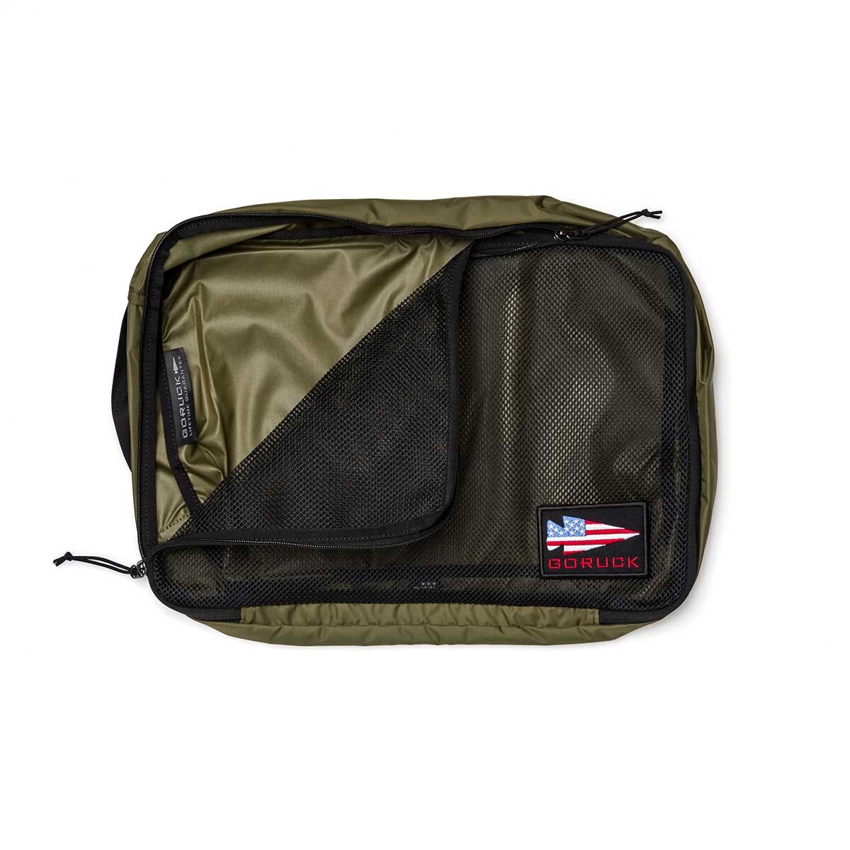 Olive green Packing Cubes made from durable 200D nylon, featuring mesh pocket, zipper, and a patch with the American flag and 