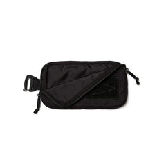 Black sternum strap pouch with zip and clip attachment, made from durable fabric, GORUCK gear