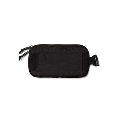 Black GORUCK sternum strap pouch made of durable fabric with double zipper and buckle attachment