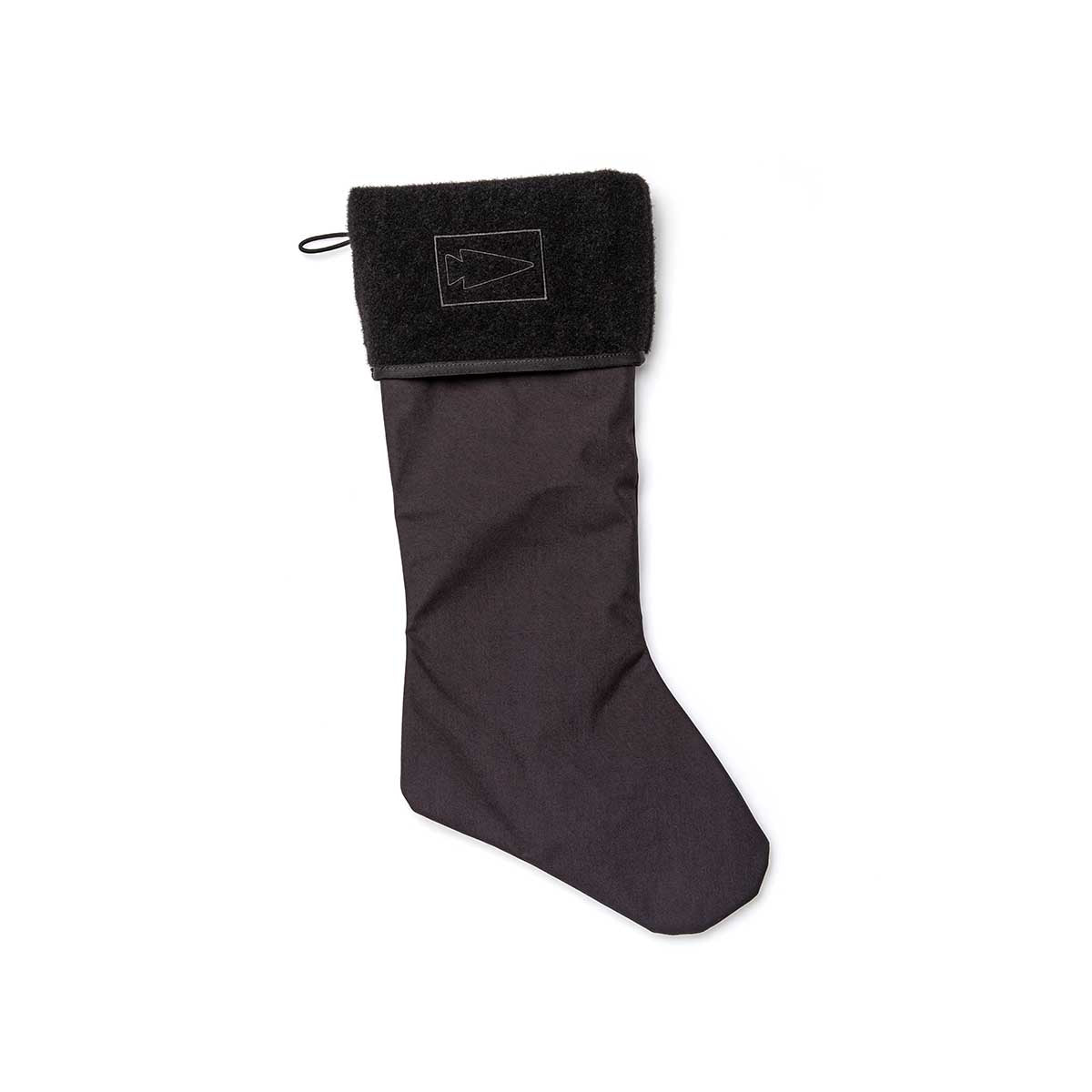 The Tough Stocking is made from durable 500D Cordura, featuring a black cuff with an arrowhead design and Velcro attachments, displayed on a white background.