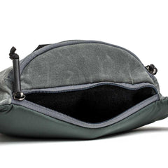 GORUCK tactical fanny pack in slate waxed canvas with open zipper and spacious interior