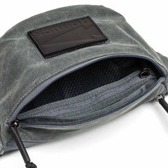 GORUCK tactical fanny pack in waxed slate canvas with open zippered compartment