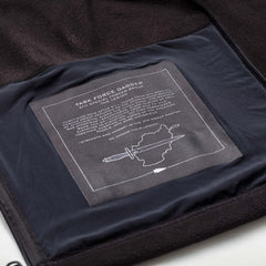 Inside view of black Task Force Dagger fleece jacket with detailed print honoring 5th Special Forces Group and a dagger and map graphic