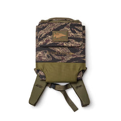 The Ruck Plate Carrier 3.0 is a camouflage-patterned tactical backpack made from ballistic nylon with olive green straps and a "GORUCK" patch on the front.