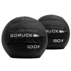 Two black Medicine Ball Bundle sandbags labeled 100 and 80 sit side by side on a white background, ideal for home gyms or portable training sessions.