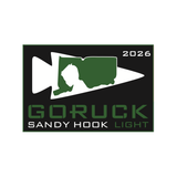 Sandy Hook Memorial - Light Challenge 2026 logo features green and white graphics on a black background, honoring the Sandy Hook Promise Foundation and commemorating the Sandy Hook Memorial rucking event.