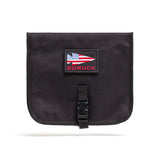 The Wire Dopp is a black pouch with an American flag patch and "GORUCK" text, front buckle closure—ideal as a travel organizer or cable pouch for your EDC essentials.
