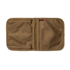 The Wire Dopp is an open tan mesh storage organizer with multiple zippered compartments, crafted from durable CORDURA—perfect for keeping your travel essentials organized.