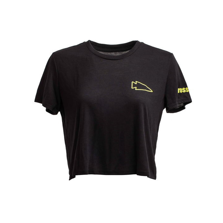 The Women's Subtle Spearhead x CrossFit Cropped Tee by GORUCK is crafted from a premium poly-blend for workouts. It boasts a minimalist design featuring a small abstract yellow logo on the left chest and partial yellow text on the sleeve, set against a plain white background.