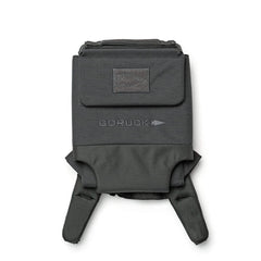 The Ruck Plate Carrier 3.0 by GORUCK is a black tactical vest featuring Velcro straps and the brand's embroidered logo on the front. Constructed from durable 1000D CORDURA, it offers multiple pockets and ergonomic lumbar support for superior comfort and practicality.