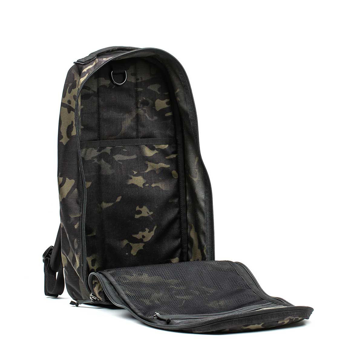 The Bullet Ruck Classic - Ballistic Nylon Cordura backpack in camouflage is shown with its 15L main compartment unzipped, revealing spacious interior and mesh pocket.