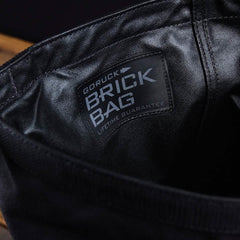 GORUCK Brick Bag closeup, durable black rucking gear with lifetime guarantee label