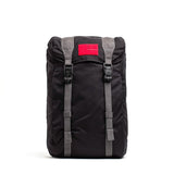 GORUCK black rucksack with gray straps and red patch, rugged outdoor backpack for rucking
