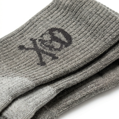 Tribe Merino Challenge Socks - Crew: gray crew socks featuring a black skull and crossbones design near the top, crafted for comfort and style—perfect for fans of the best wool socks.