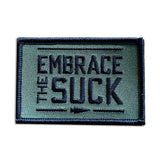 GORUCK green embroidered patch with bold text Embrace The Suck, motivational rucking gear