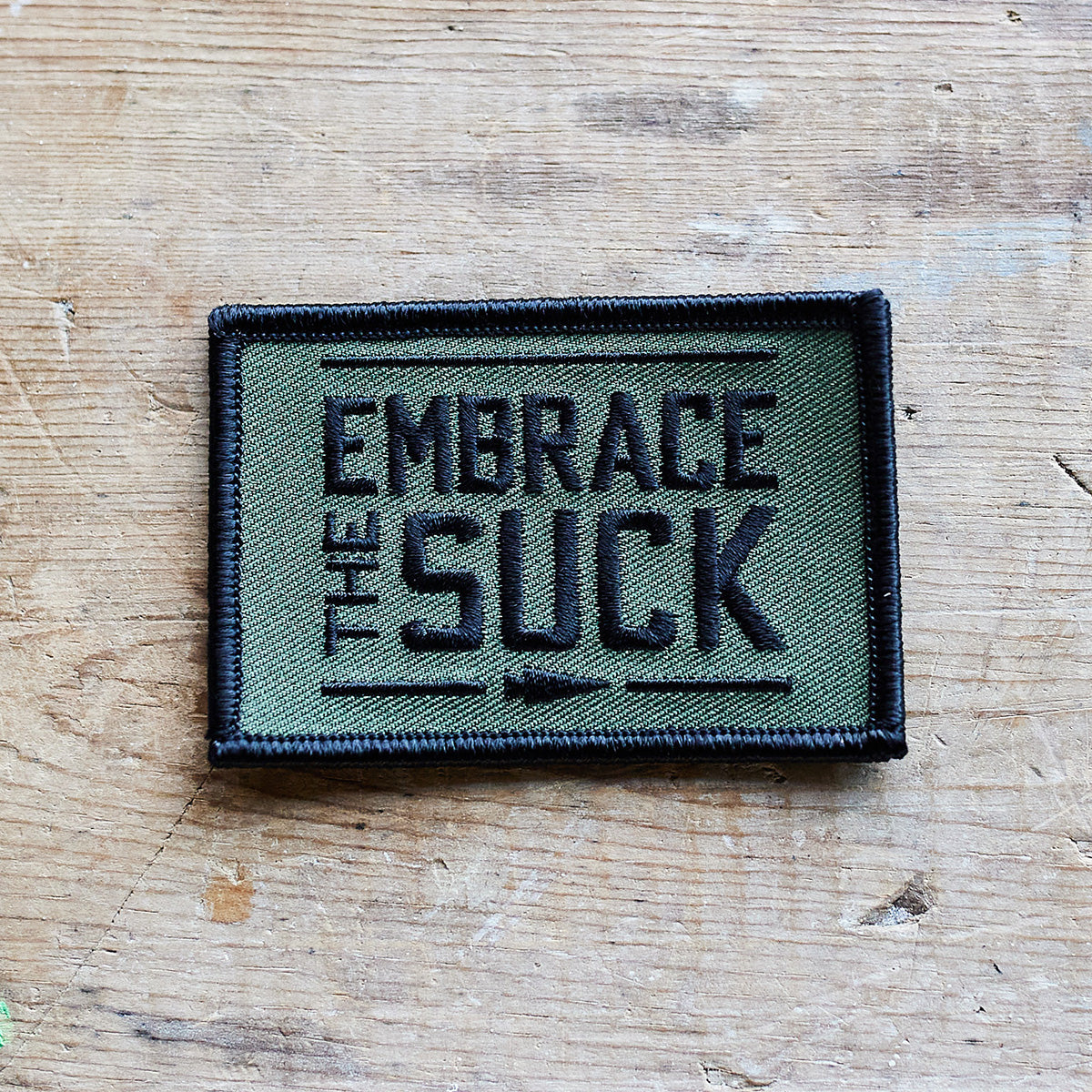 An embroidered patch from vendor-unknown, titled 
